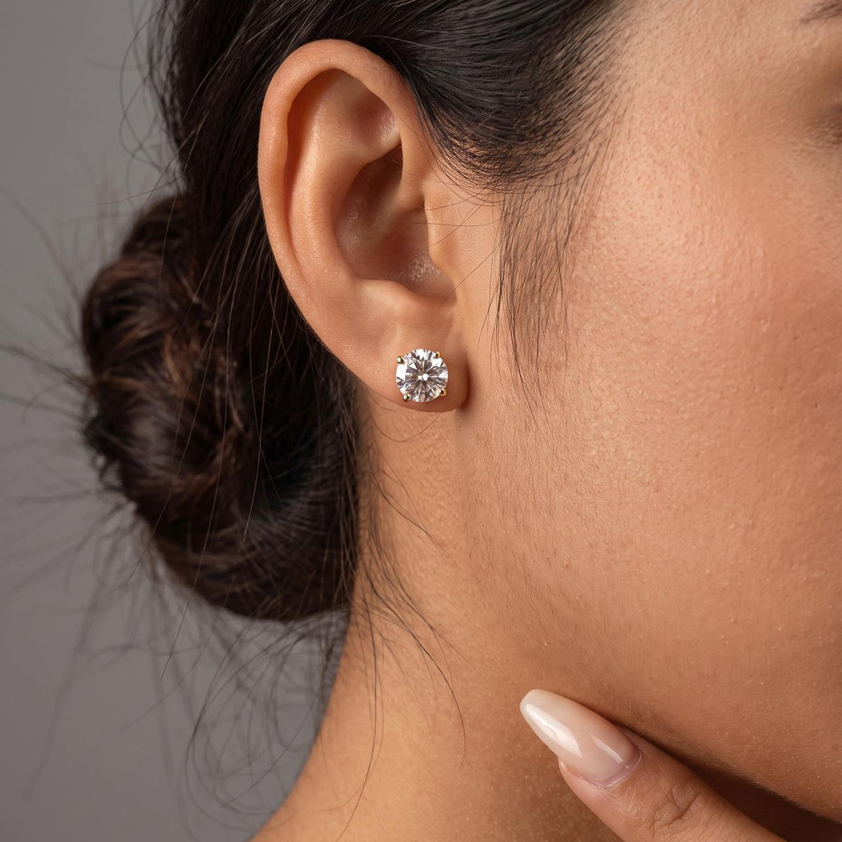Aurelia Stud Earrings in Gold worn on ear