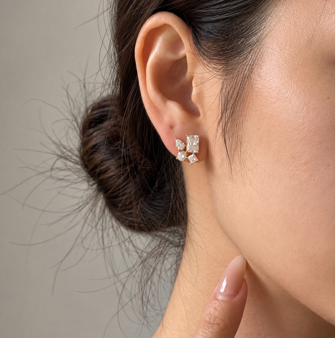 Model wearing Elara Earrings in gold